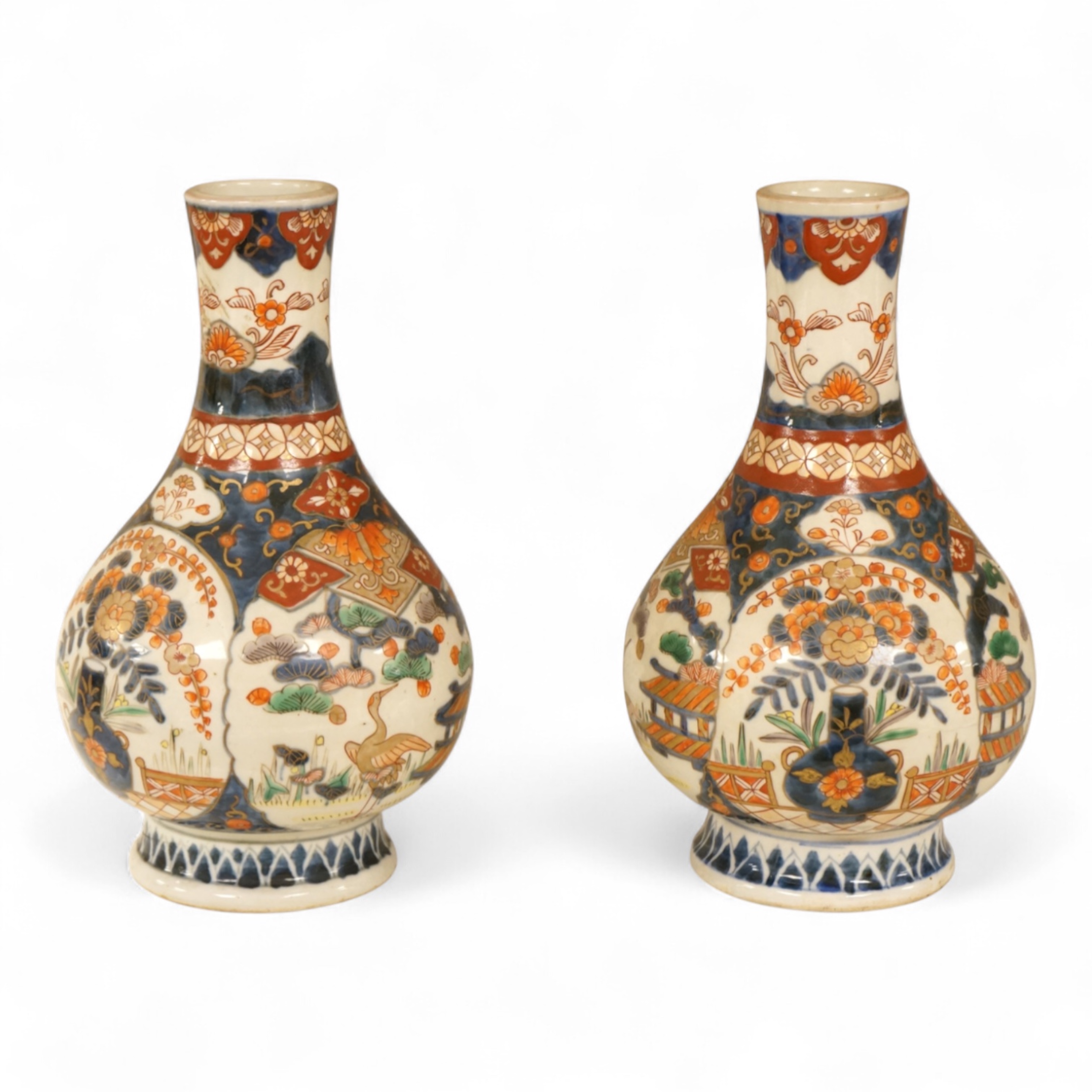 A pair of 19th century Japanese Imari bottle vases, 22cm high